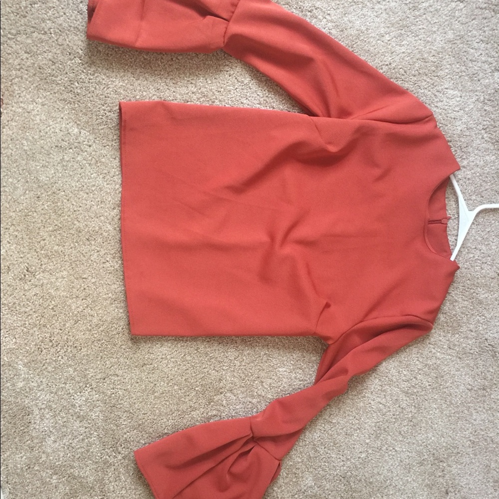 Orange bell sleeve top